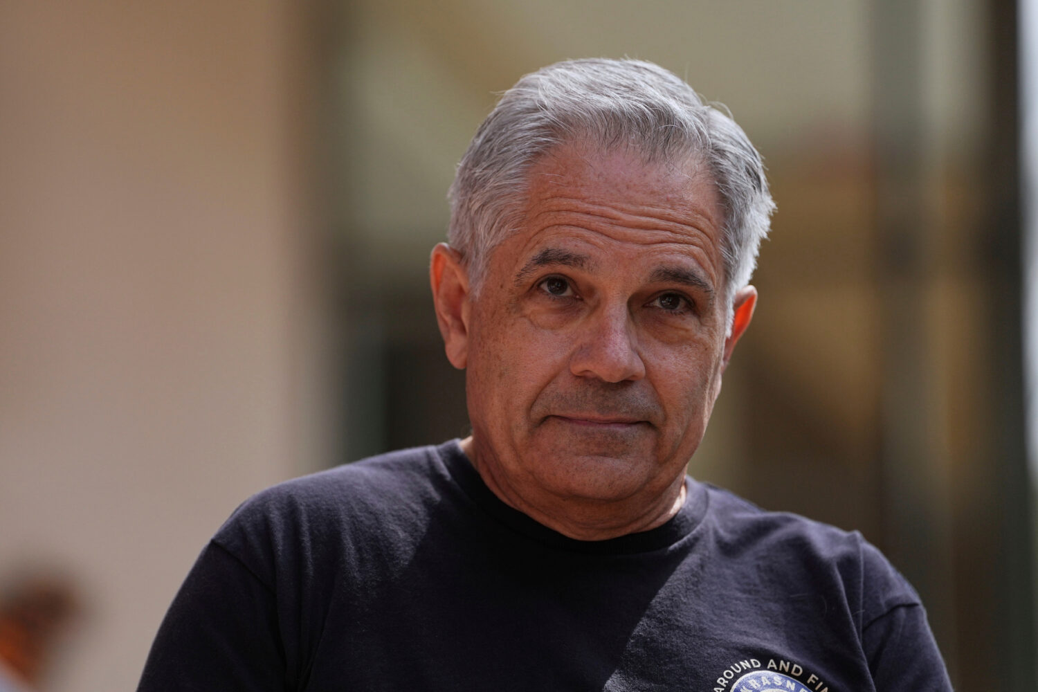 FILE - Philadelphia District Attorney Larry Krasner joins immigrant rights supporters as they demon...