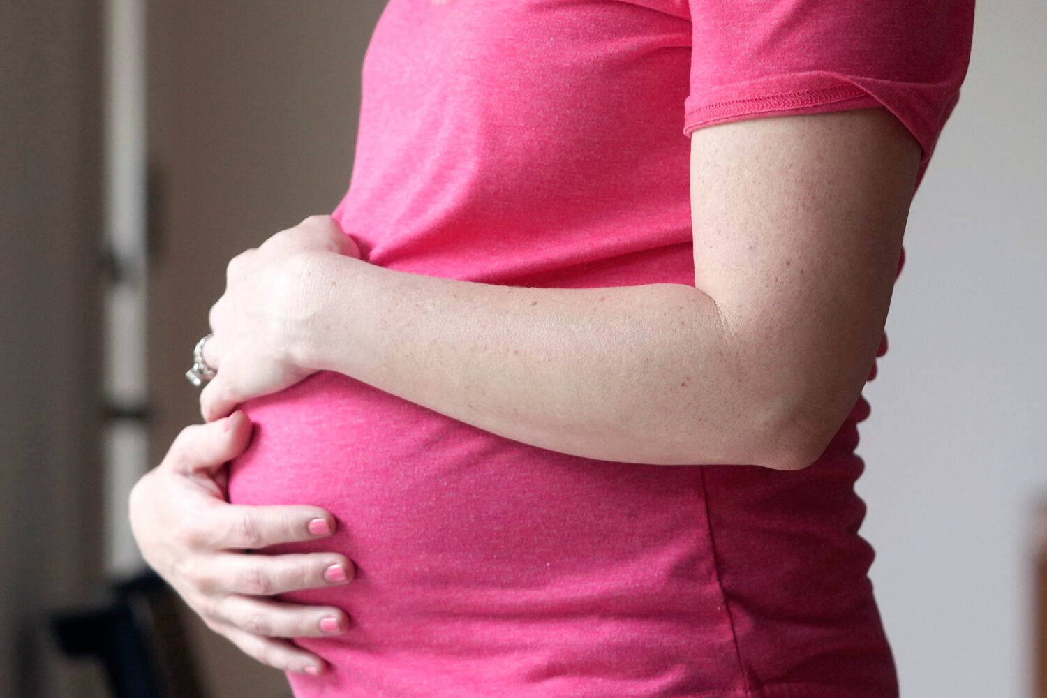 FILE - A pregnant woman stands for a portrait in Dallas, May 18, 2023. (AP Photo/LM Otero, File)Cre...