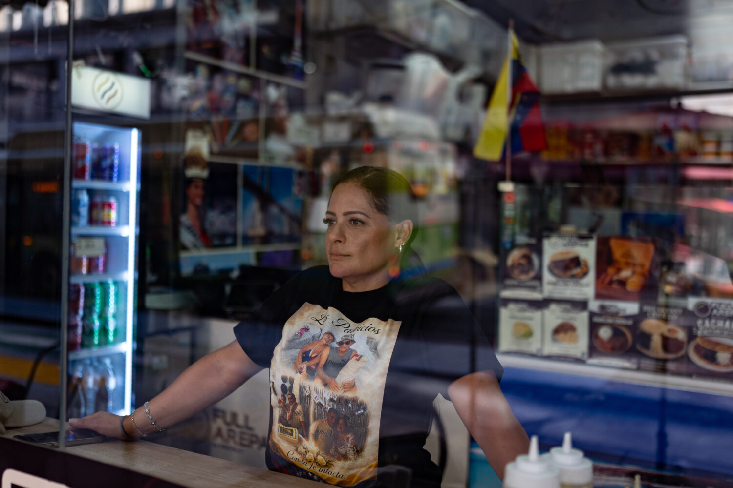 Kelly Granado, whose parents died in Venezuela's June 24 earthquakes, poses for photos at her resta...