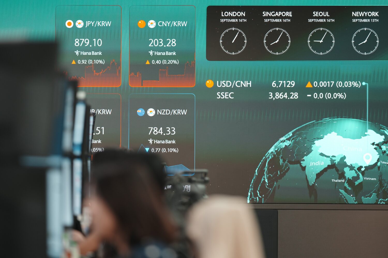 The screens showing the foreign exchange rates are displayed at a dealing room of Hana Bank in Seou...