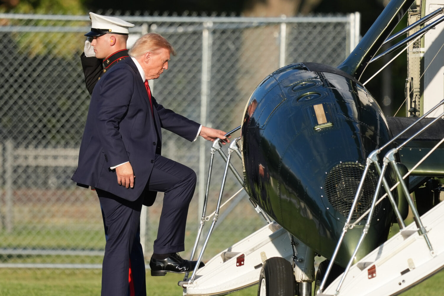 President Donald Trump boards Marine One on the Ellipse near the White House, Friday, Sept. 18, 202...