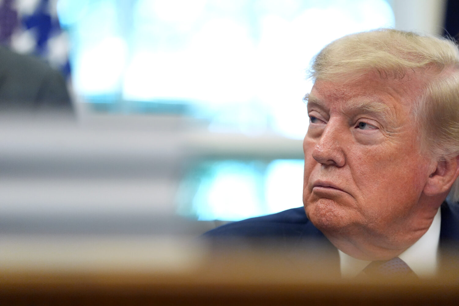 President Donald Trump listens during an event in the Oval Office of the White House, Monday, Sept....