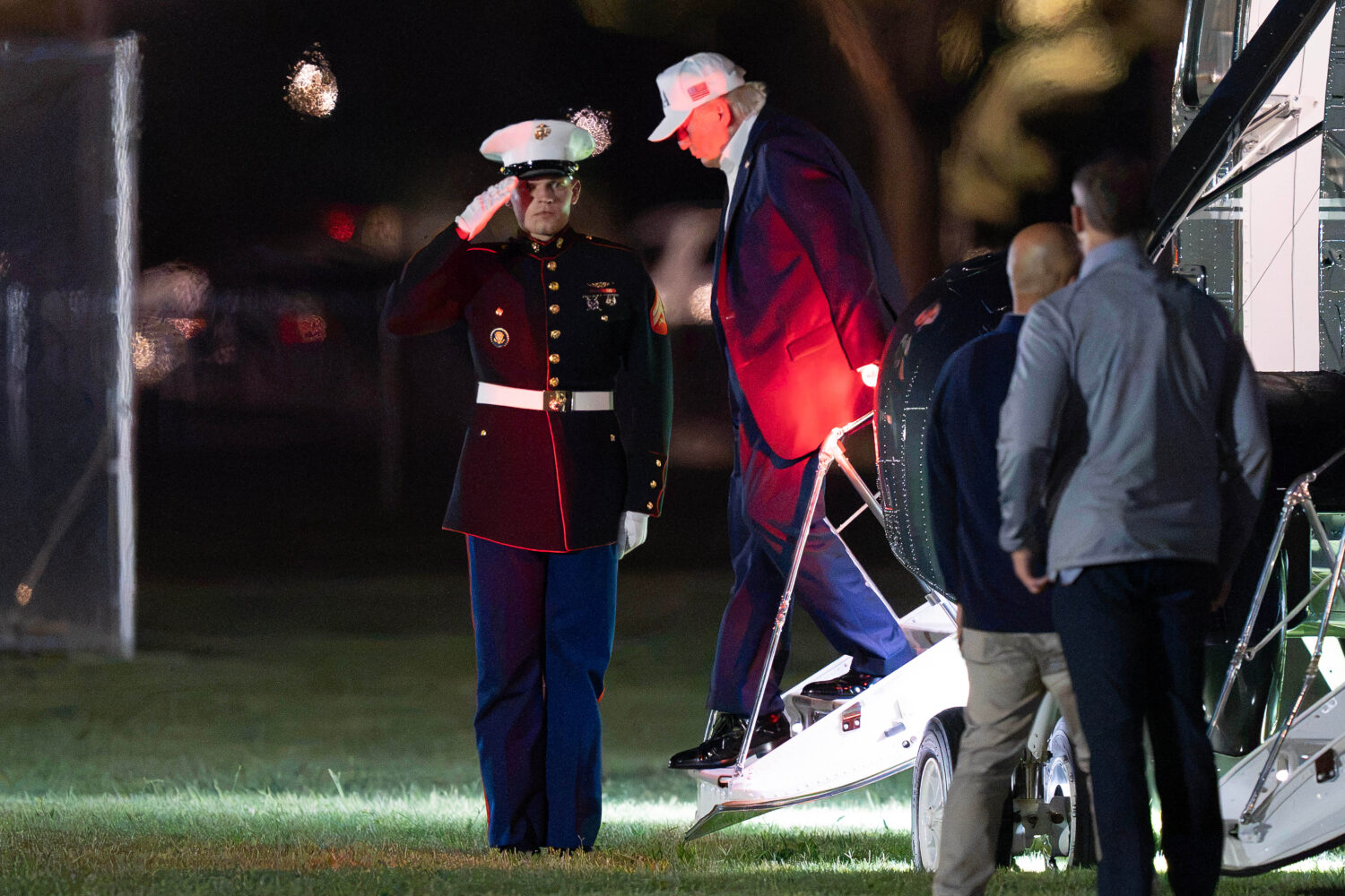 President Donald Trump steps off from Marine One upon his arrival at the Ellipse just outside of th...