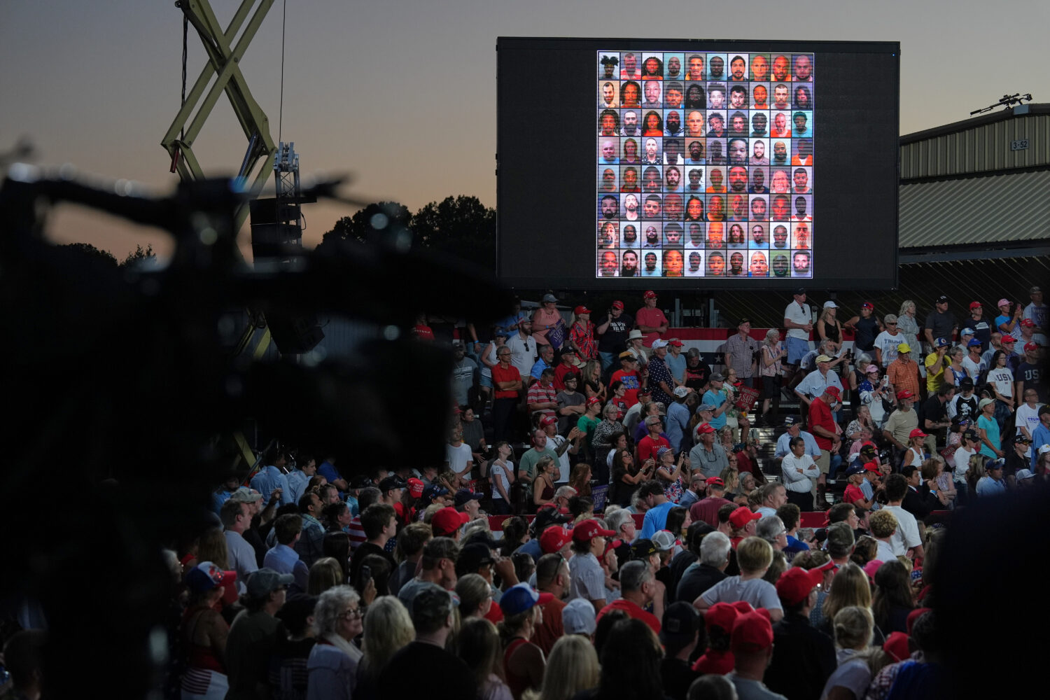 A image is seen on a screen as President Donald Trump speaks during a rally at Gastonia Municipal A...