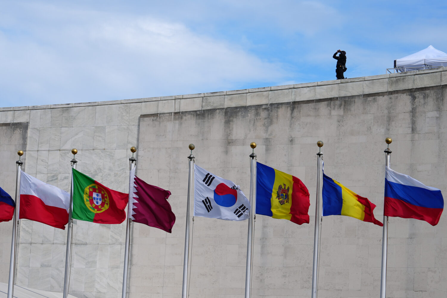 Flags fly at the United Nations Tuesday, Sept. 22, 2026, at the UN headquarters, as security keeps ...