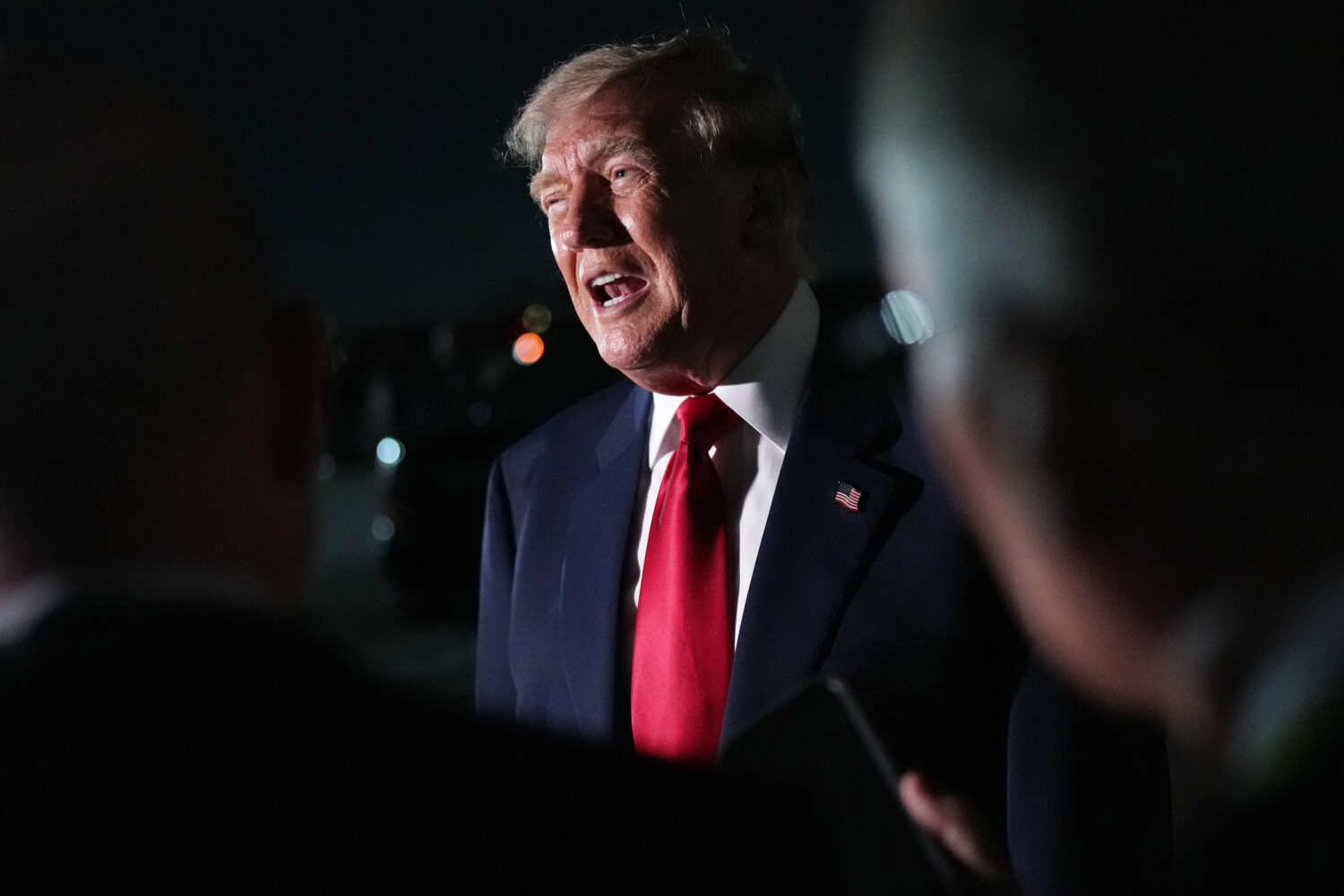 President Donald Trump speaks to reporters before he boards Air Force One at Dallas Fort Worth Inte...
