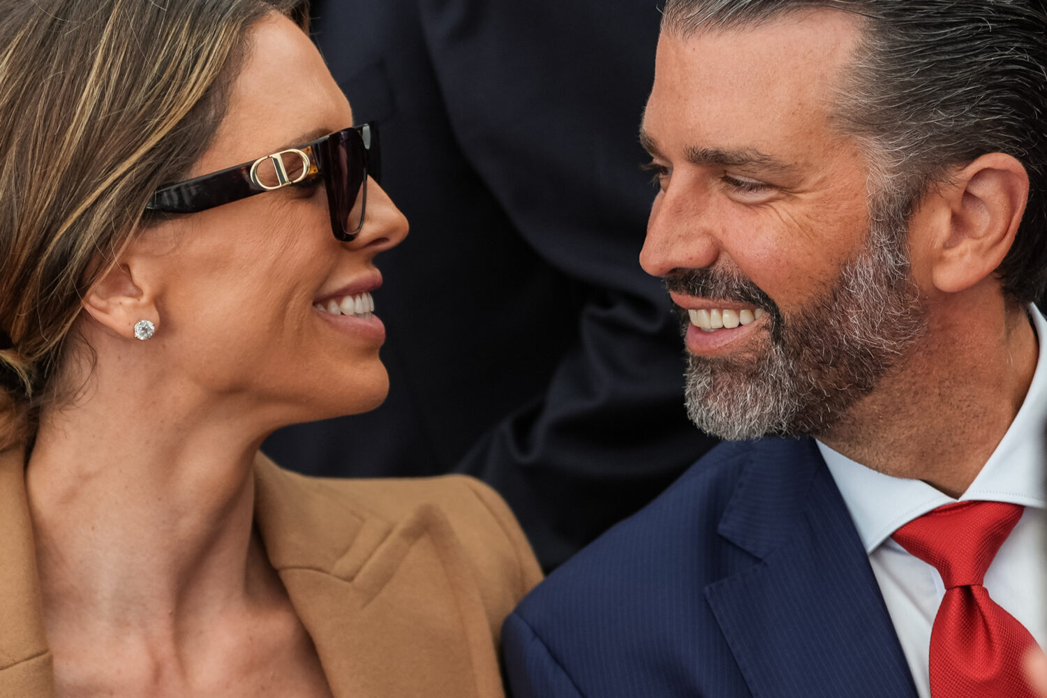 Donald Trump Jr. and his wife Bettina Anderson look at each other while waiting for President Donal...