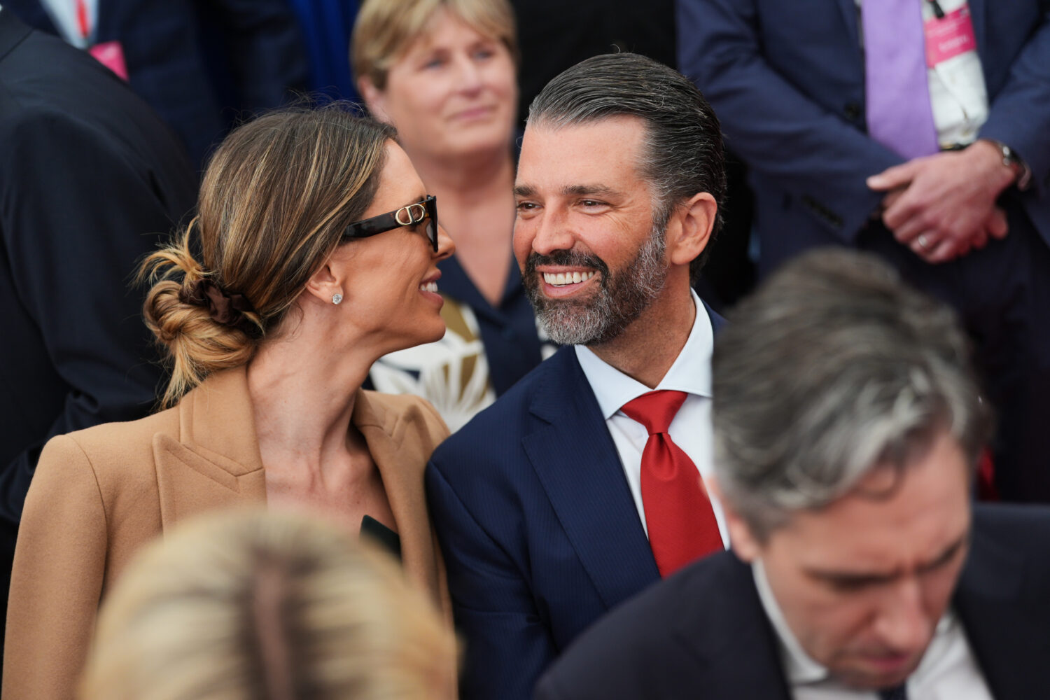 Donald Trump Jr, center, speaks with his wife Bettina, left, as they wait for U.S. President Donald...