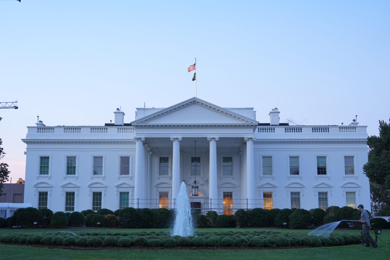 A worker waters plants on the North Lawn of the White House Monday, Sept. 21, 2026, in Washington. ...