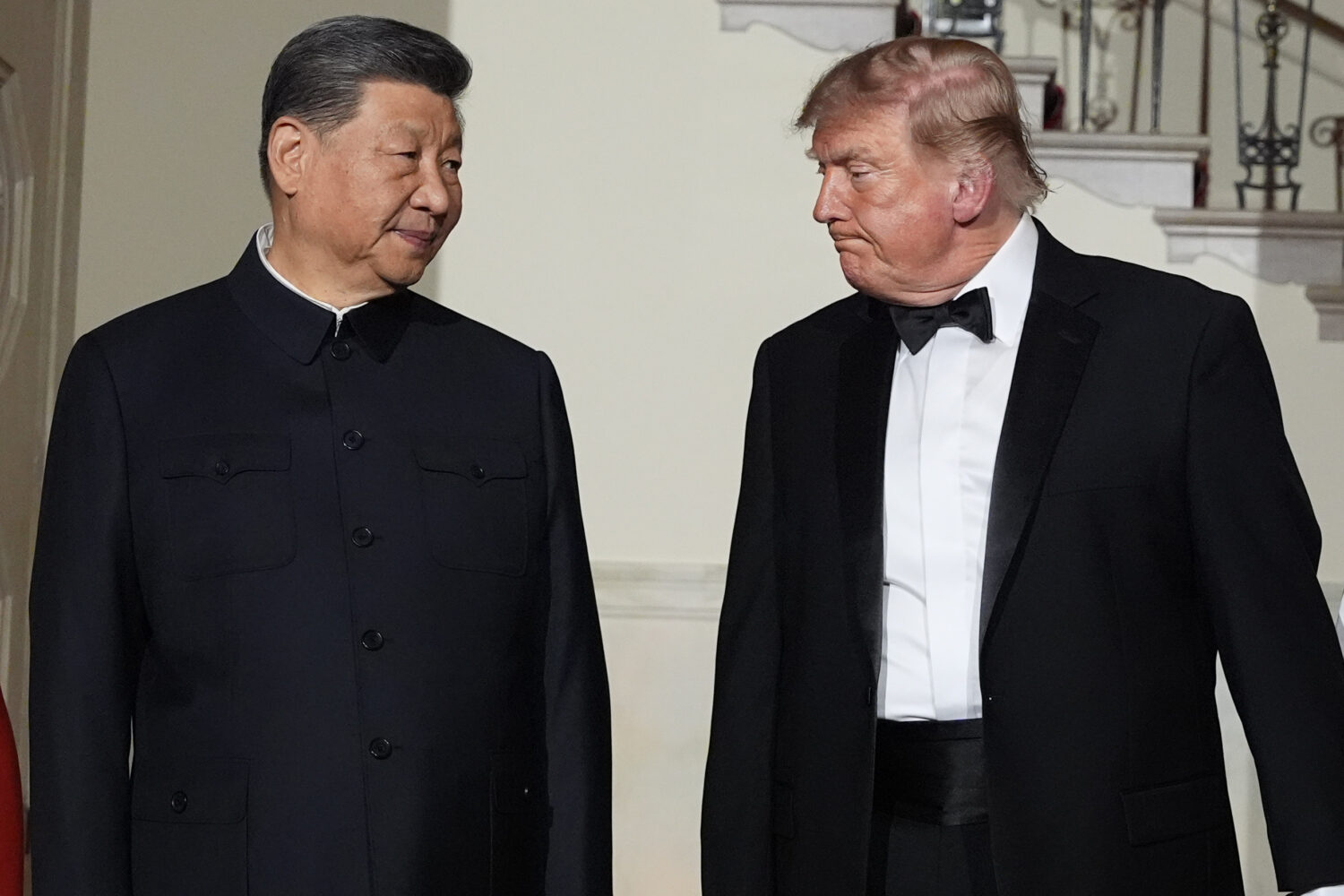 President Donald Trump and China's President Xi Jinping walk in the Grand Foyer of the White House ...