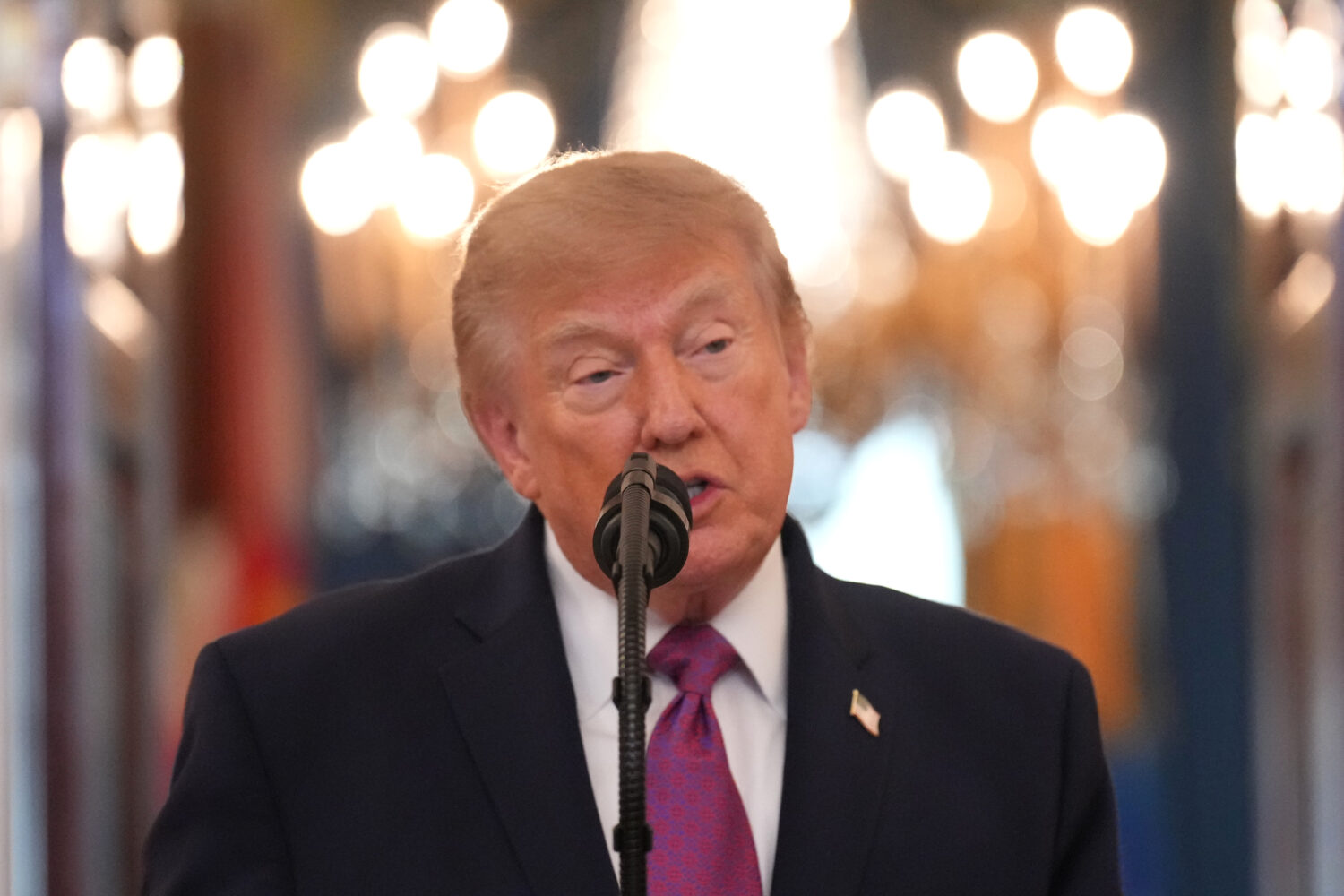 President Donald Trump speaks during an arrival ceremony with China's President Xi Jinping in the G...