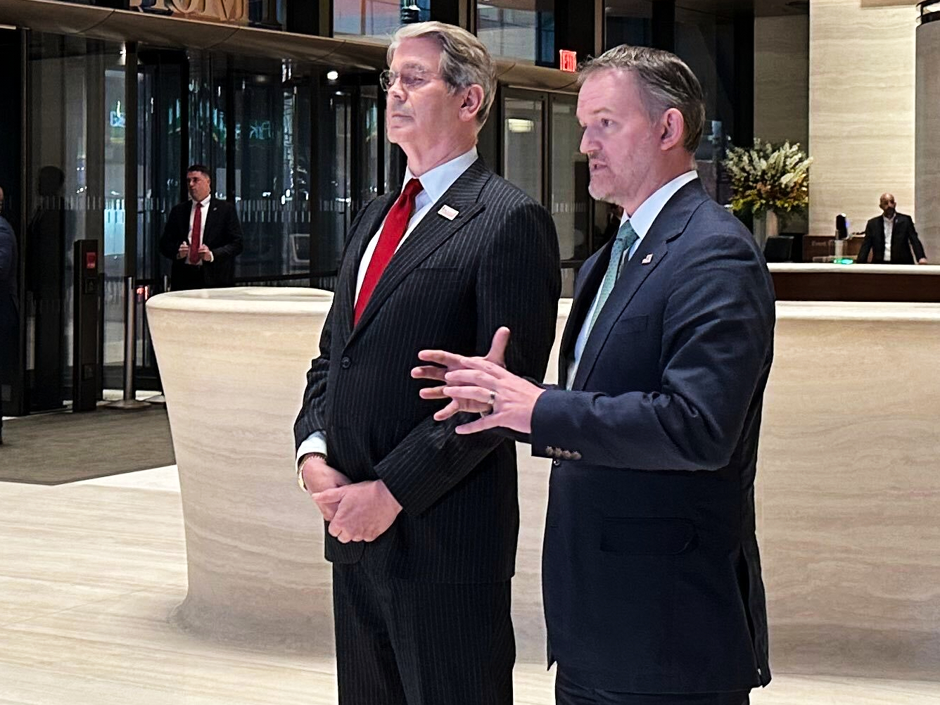 In this photo taken with a smartphone, U.S. Treasury Secretary Scott Bessent, left, and U.S. Trade ...