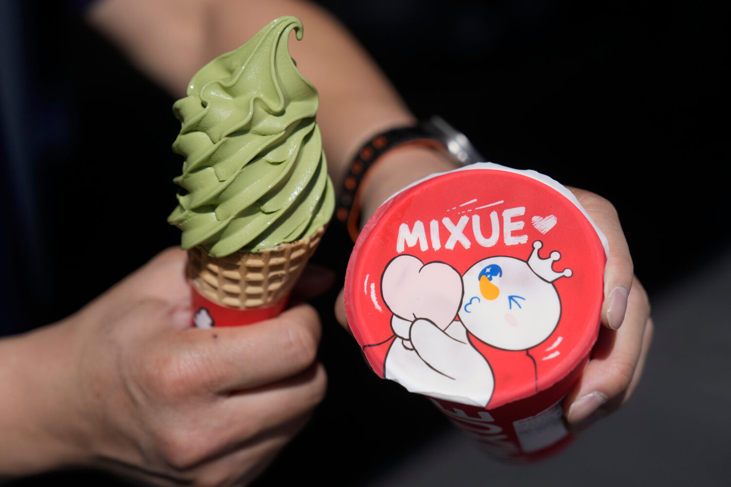 A customer holds an ice cream cone outside of a Mixue store, Wednesday, Sept. 16, 2026, in Sunnyval...