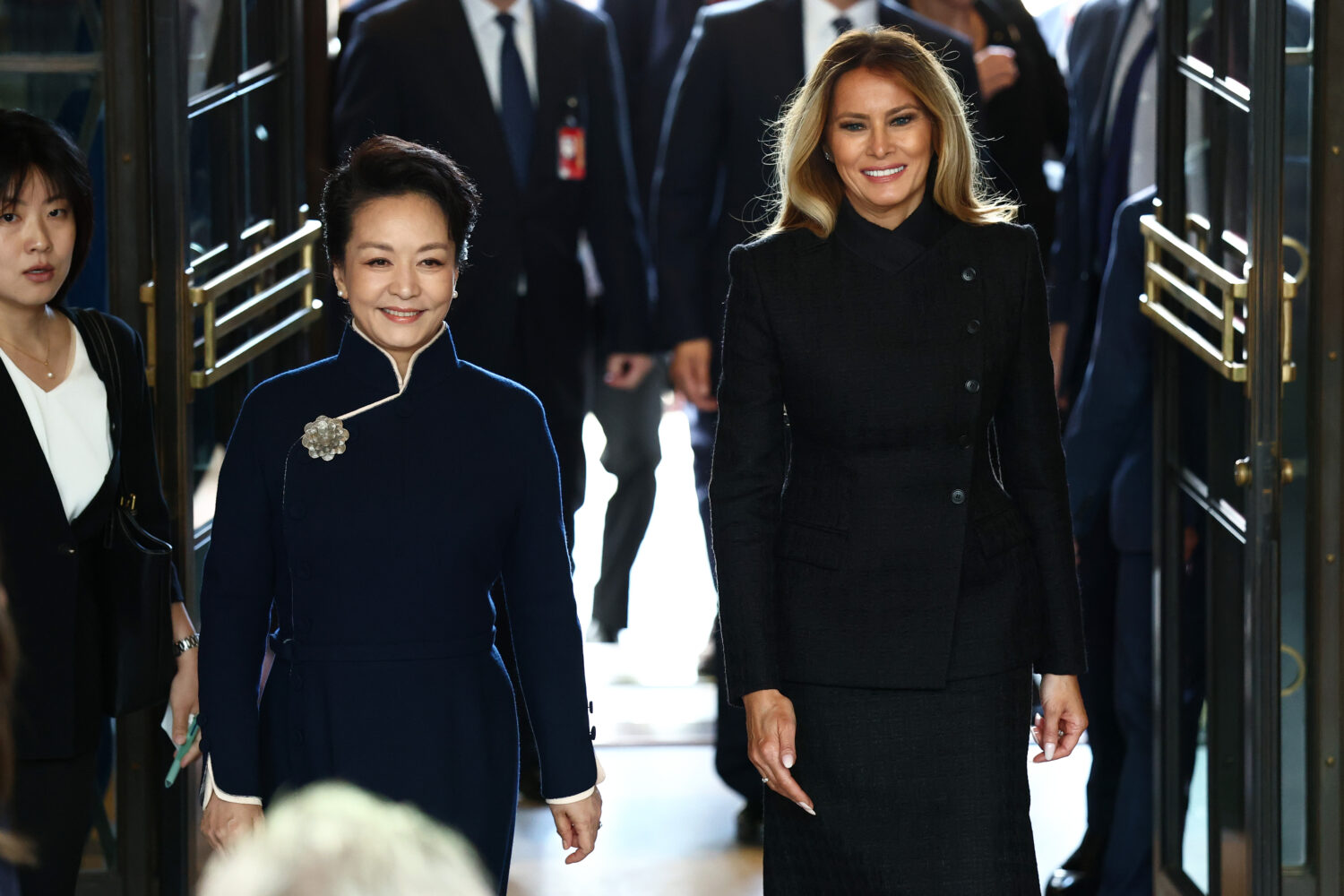 First lady of China Peng Liyuan, left, and first lady Melania Trump arrive to a visit at the Smiths...