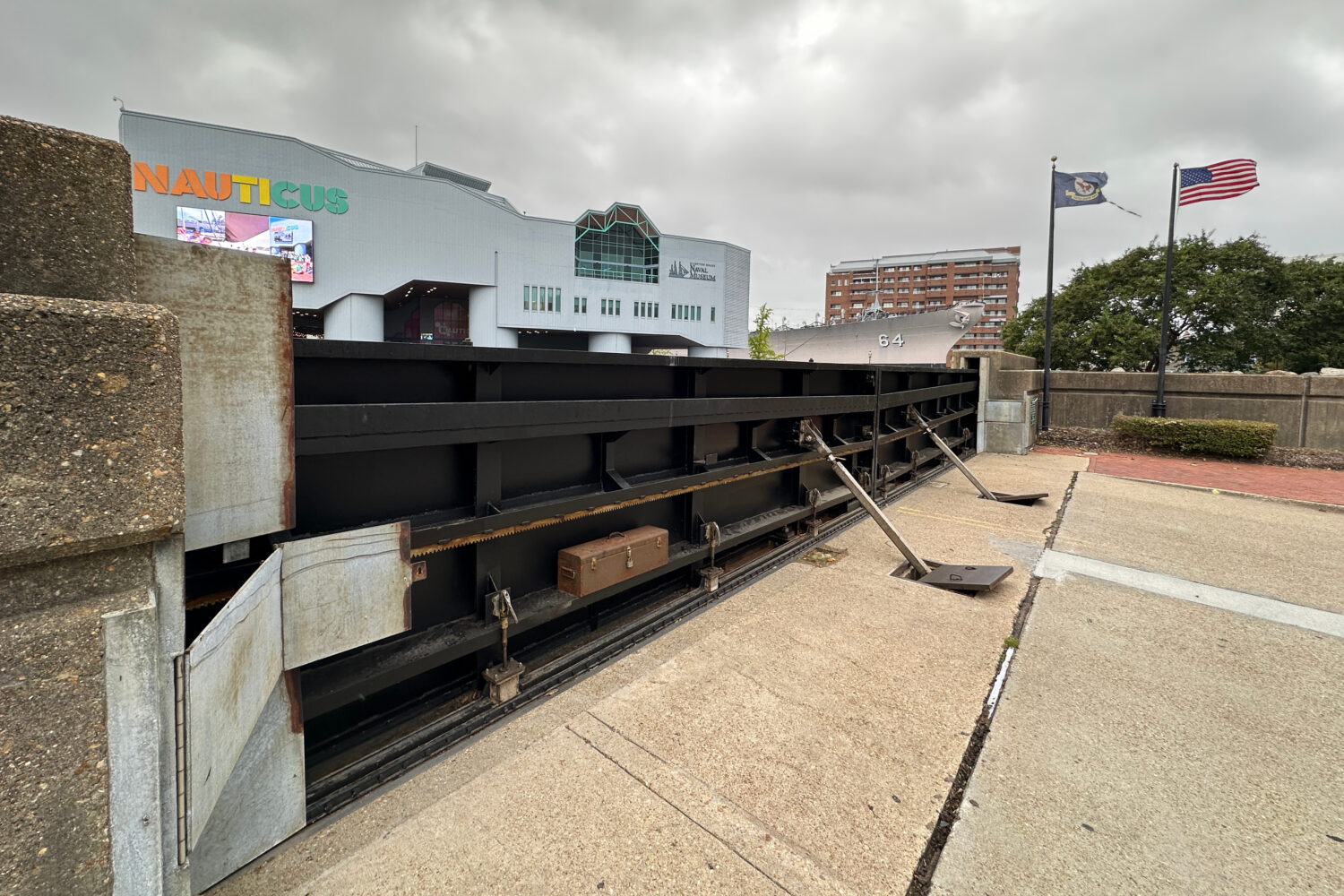 A flood gate blocks Main Street from the waterfront in Norfolk, Va., as a nor'easter works its way ...