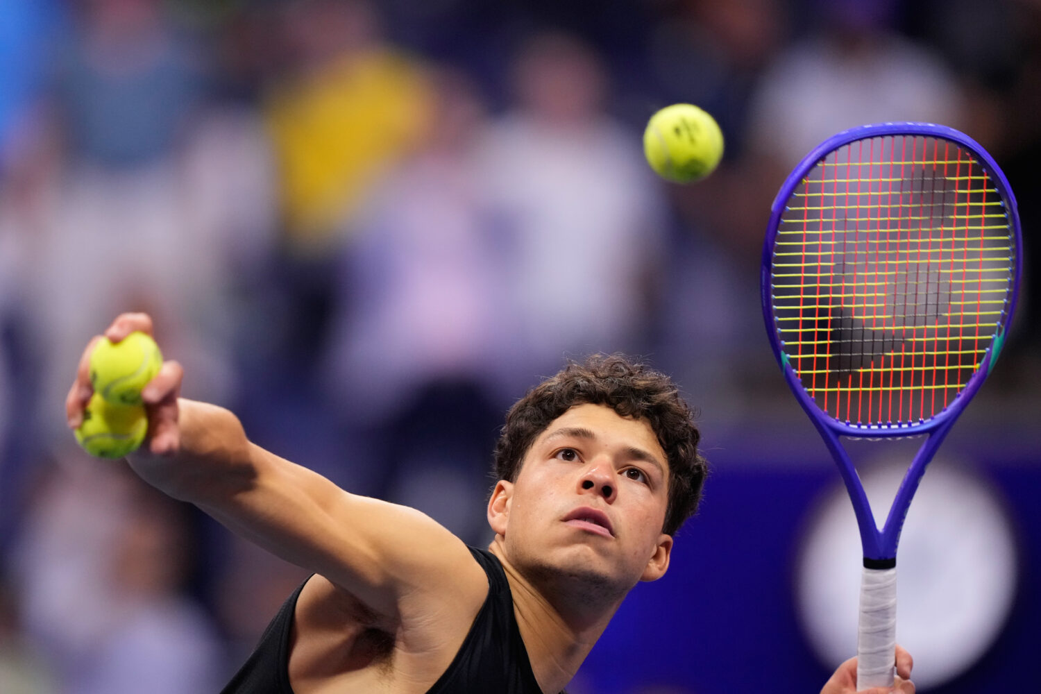 Ben Shelton, of the United States, hits balls to audience after he won his match against Frances Ti...