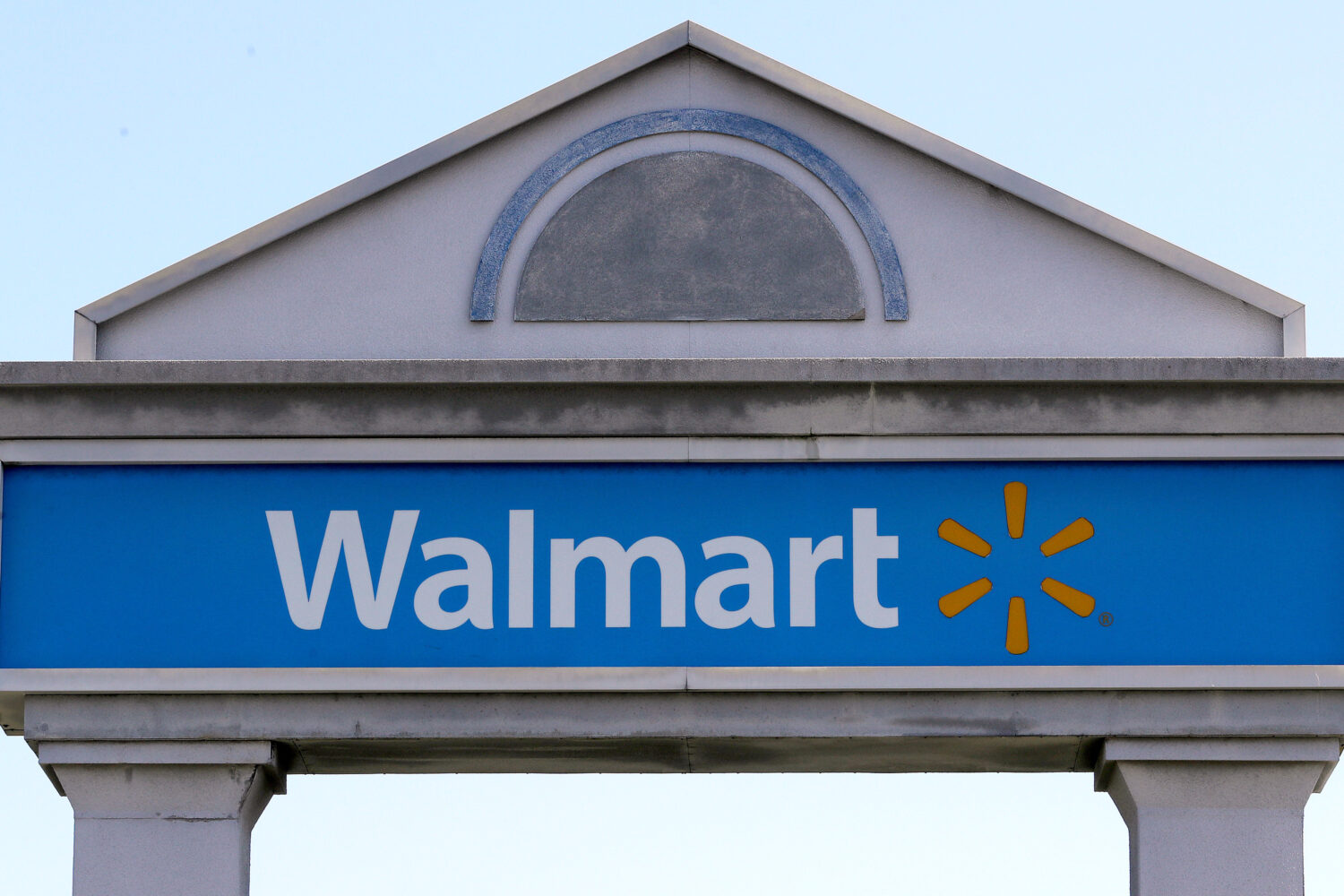 FILE - A Walmart sign stands outside a store, Sept. 3, 2019, in Walpole, Mass. (AP Photo/Steven Sen...