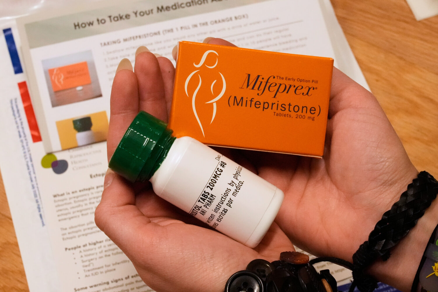 FILE - A coordinator shows the medications and care kit sent out the clients at the Massachusetts M...
