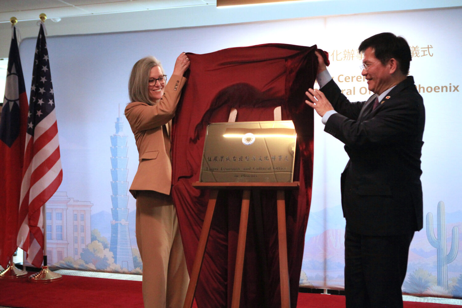 Arizona Gov. Katie Hobbs, left, and Taiwan's Foreign Minister Lin Chia-Lung unveil the plaque at th...