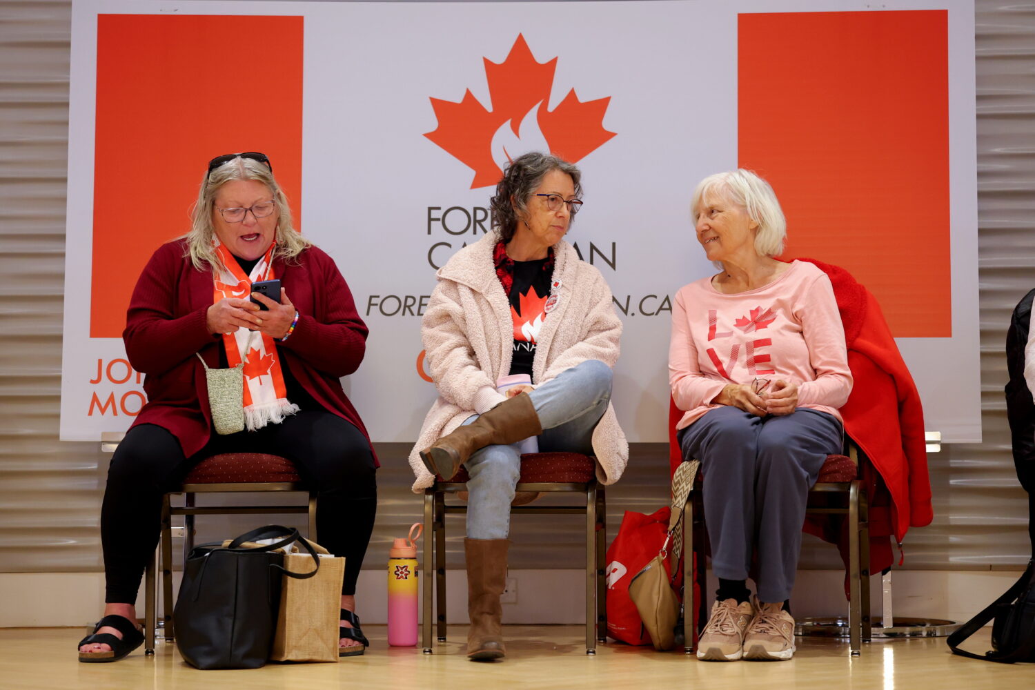 Supporters wait for results at the pro-Canada watch party in Edmonton, Alberta Monday, Oct. 19, 202...