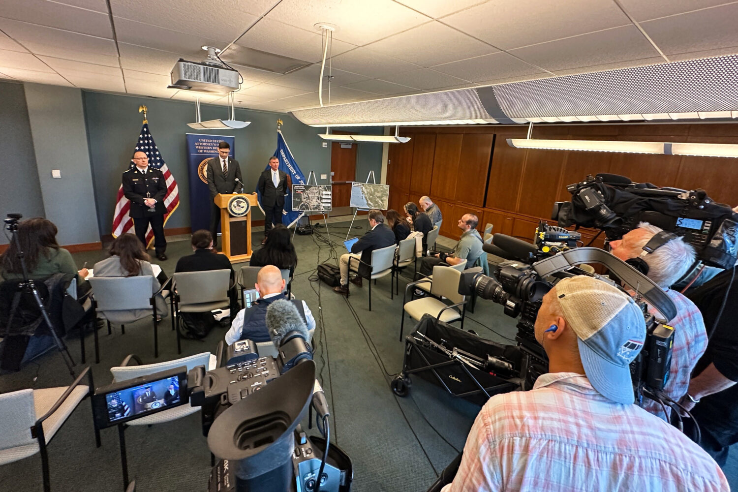 In this photo taken with a smartphone, Mike Herrington, the FBI special agent in charge, speaks to ...