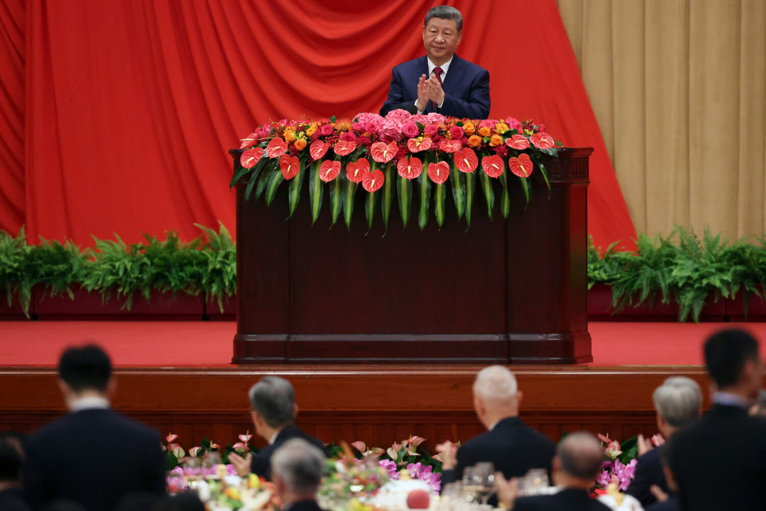 Chinese President Xi Jinping delivers a speech at the National Day reception on the eve of the 77th...
