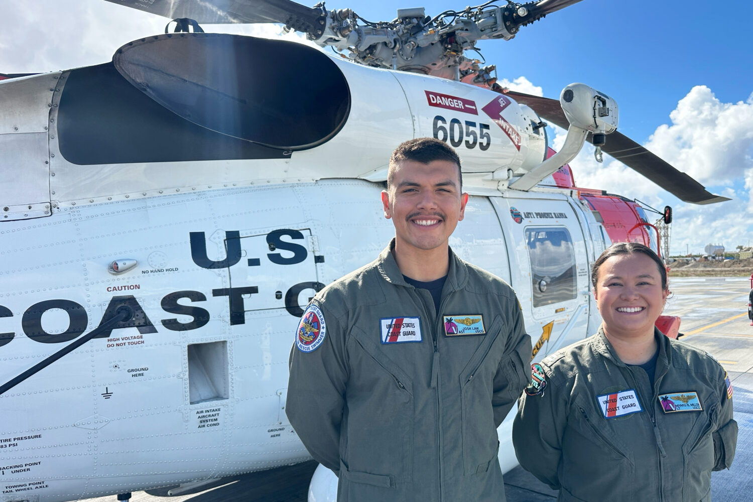 This photo made with a smartphone shows U.S. Coast Guard officer Josh Law, left, and lieutenant Miy...