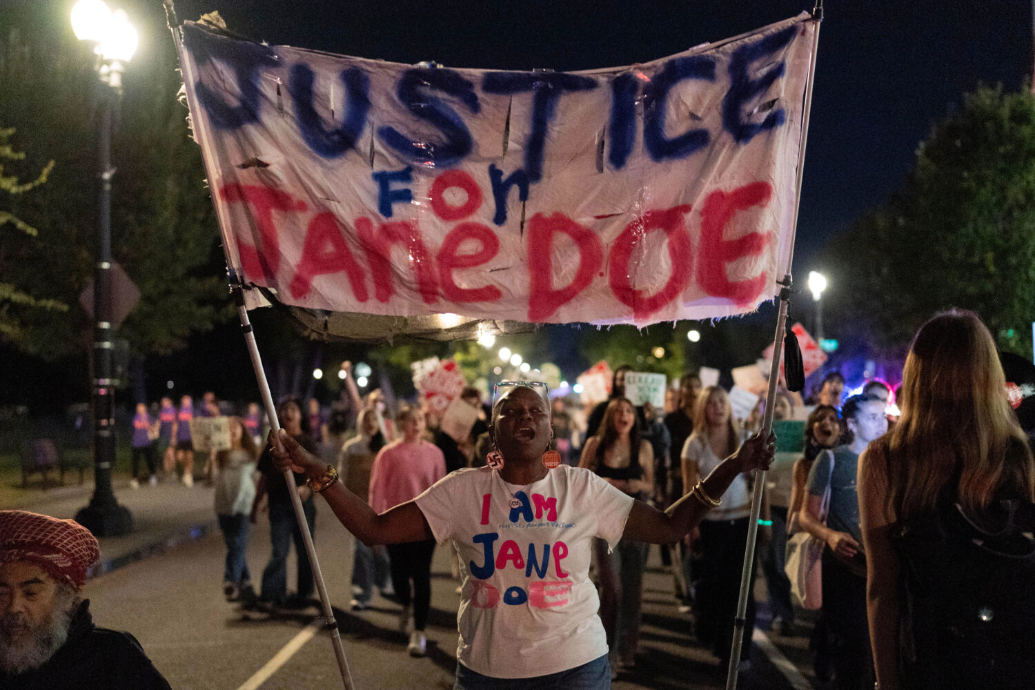 Demonstrators march from the Washington Monument to the White House during a "Stop Sexual Violence"...