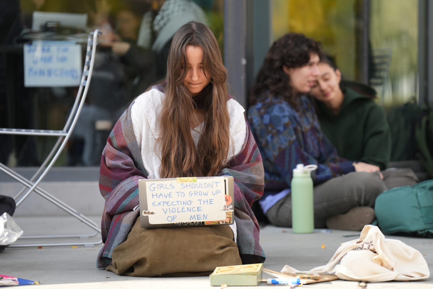 Student Isabel Breslin works on her laptop during a sit-in protest at Cornell University, Wednesday...