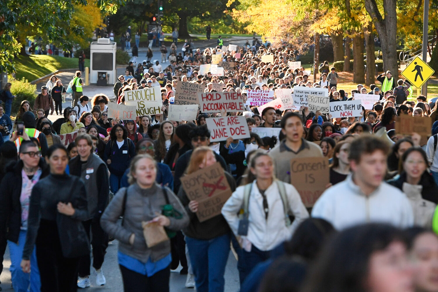 Demonstrators march during a protest against Cornell University's handling of the 2024 fraternity-h...