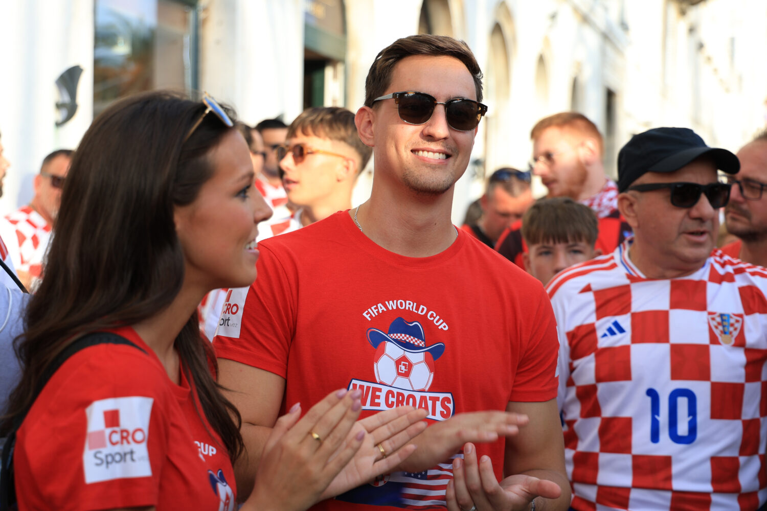 Ashton and Zachary Smith gather with Croatian supporters prior to the Nations League soccer match b...