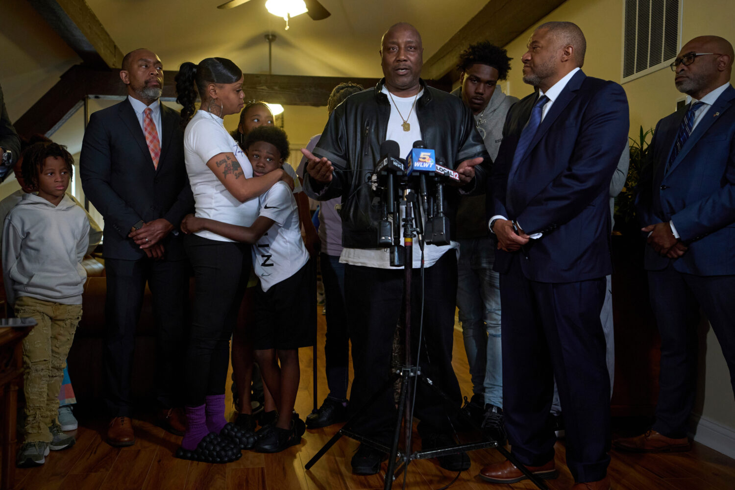 FILE - Ryan Hinton's grandfater, Rodney Hinton Sr., center, speaks during a news conference surroun...