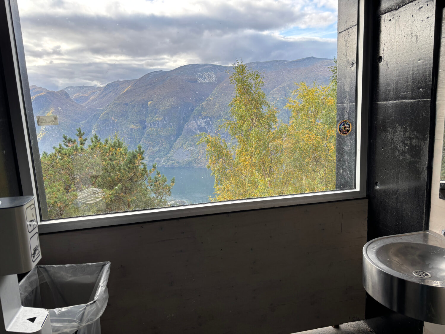 An image taken inside the public restrooms overlooking a fjord at the Stegastein viewpoint in Aurla...