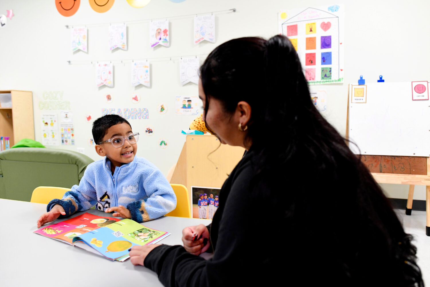 Joanna Isitt, 28, reads with her son, Xavier Rogers, 4, before teaching her Head Start class at Hom...