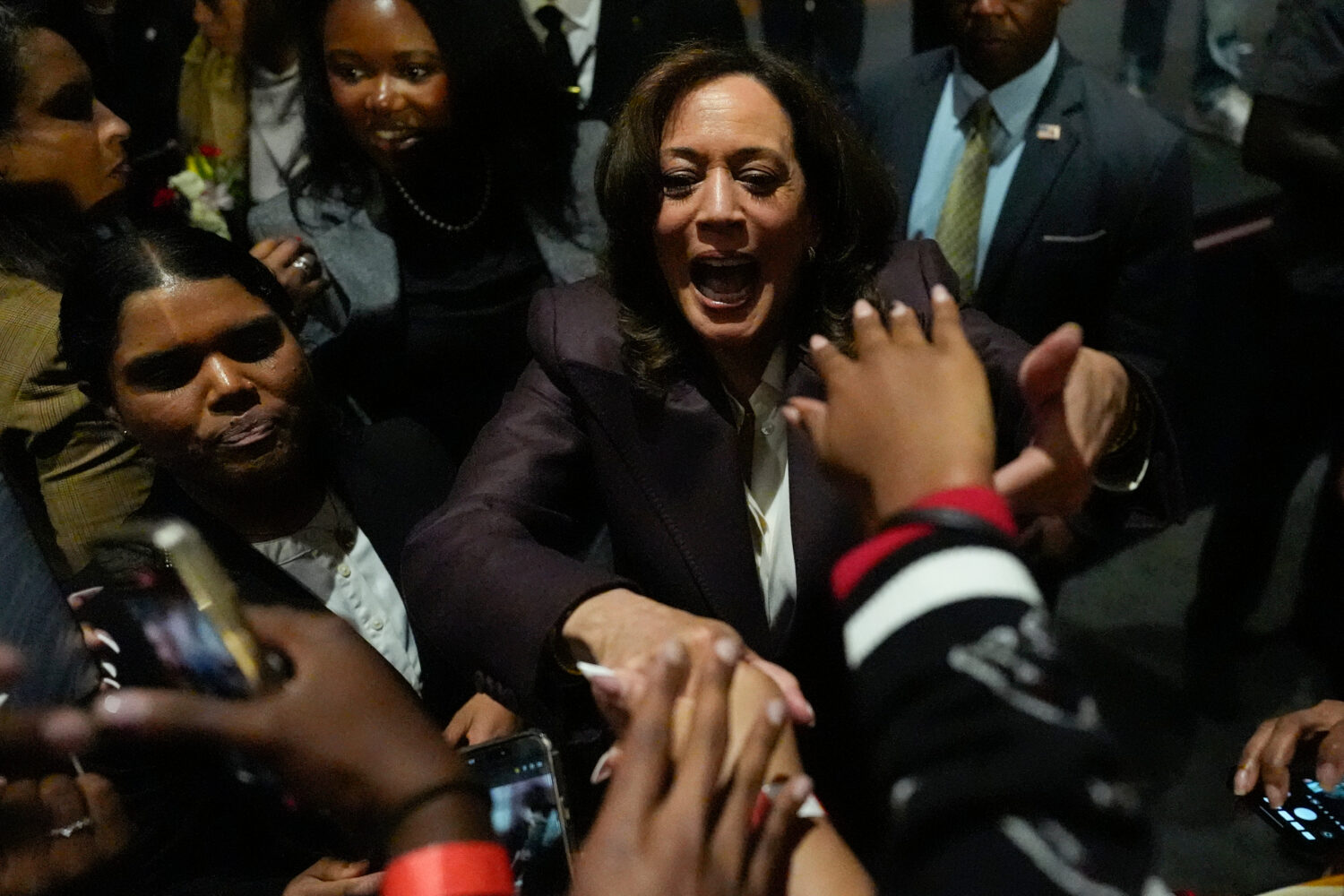 Former Vice President Kamala Harris shakes hands on the rope line during a campaign event on the ca...