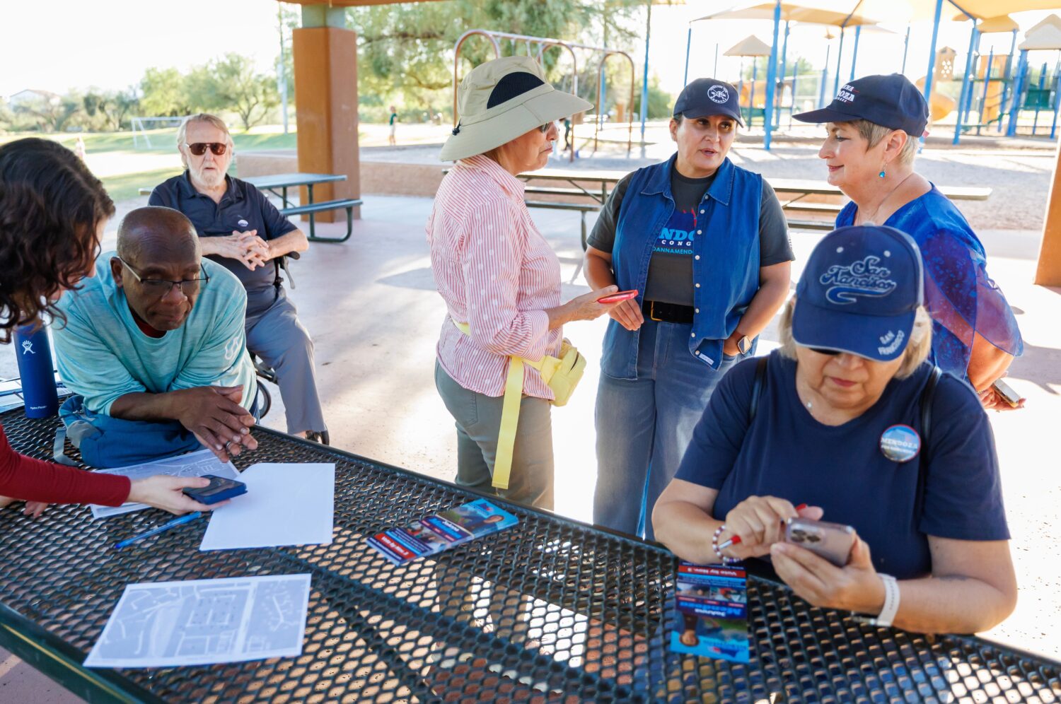 JoAnna Mendoza (D), standing second from right, an Arizona Congressional District 6 candidate, talk...
