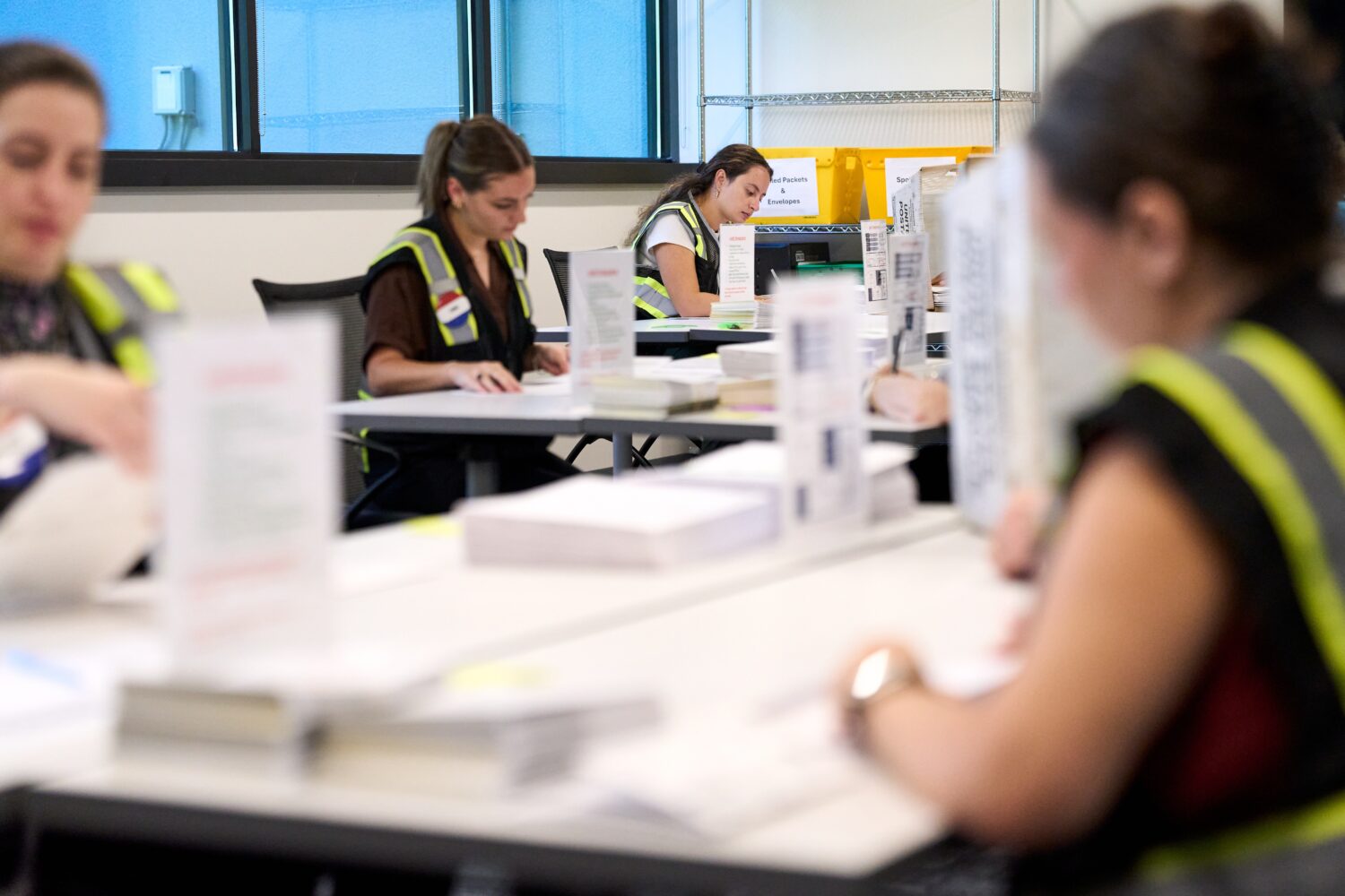 Wake County Board of Elections employees prepare absentee ballots to be mailed on Thursday, Sept. 3...