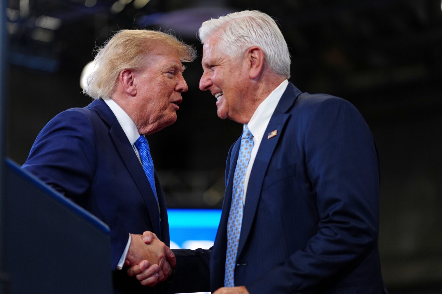 FILE - President Donald Trump, left, shakes the hand of Bruce Blakeman, the executive of Nassau Cou...
