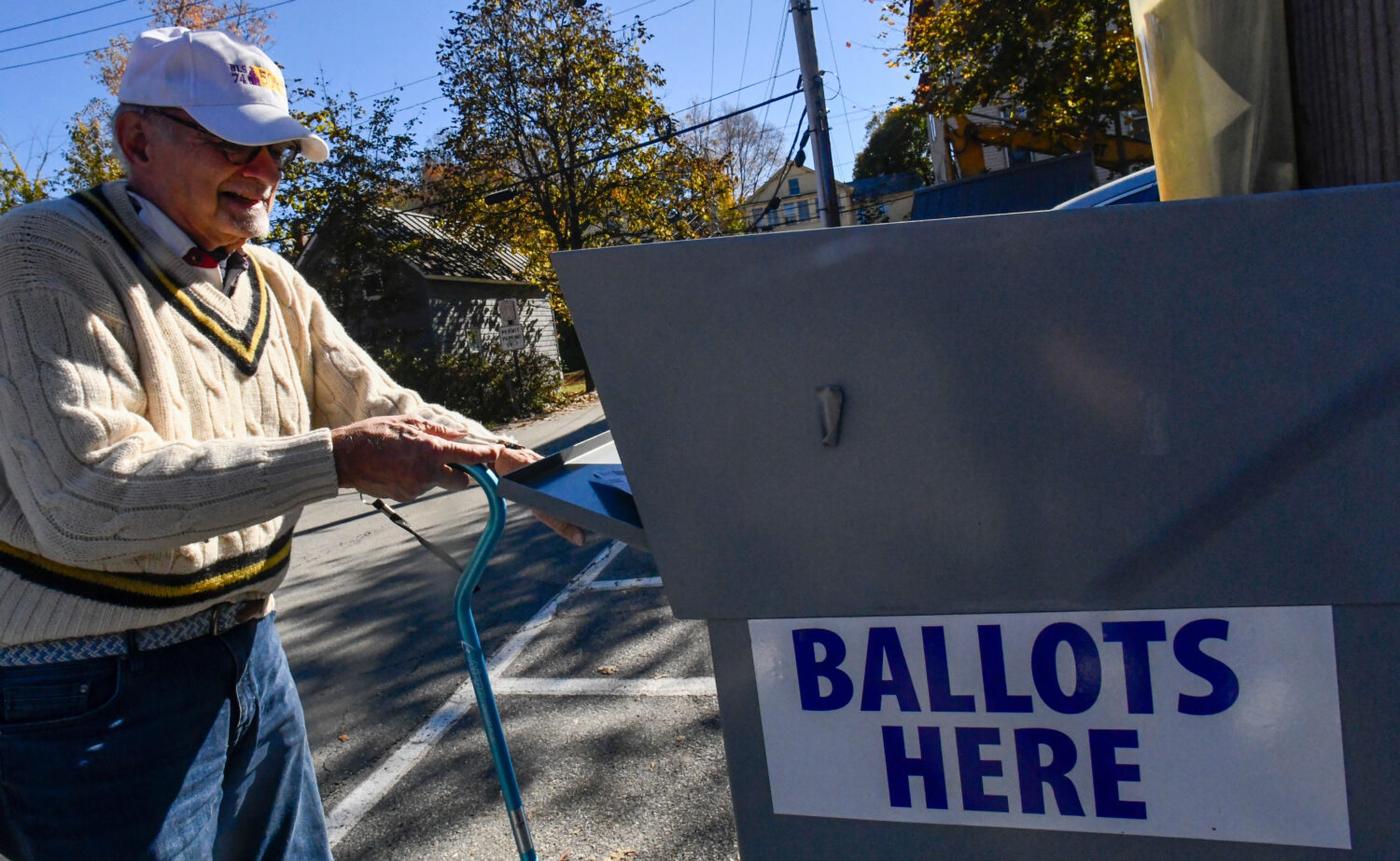 Ken Portnoy of Brattleboro, Vt., drops off his mail-in ballot at the town's ballot drop box outside...