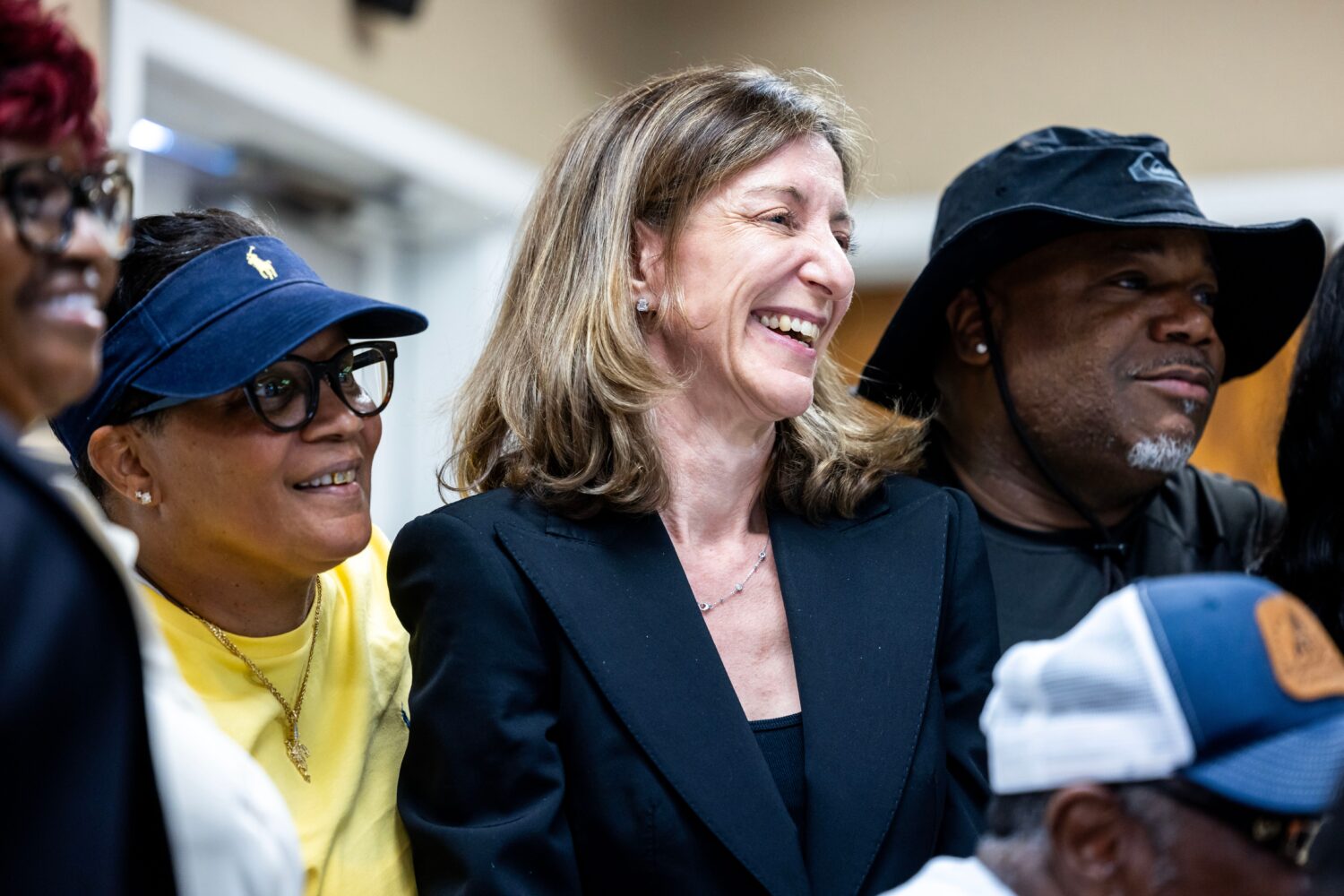 FILE - Former Rep. Elaine Luria, D-Va., stands in a group photo with members of the Amalgamated Tra...