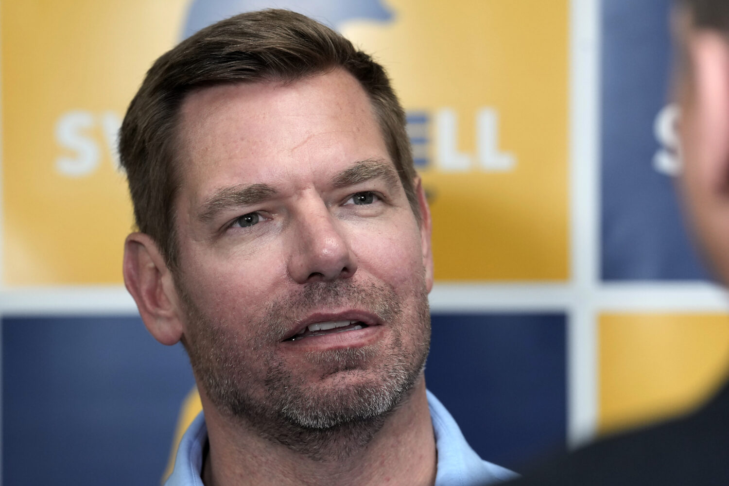 FILE - Rep. Eric Swalwell, D-Calif., talks with reporters after holding a town hall meeting in Sacr...