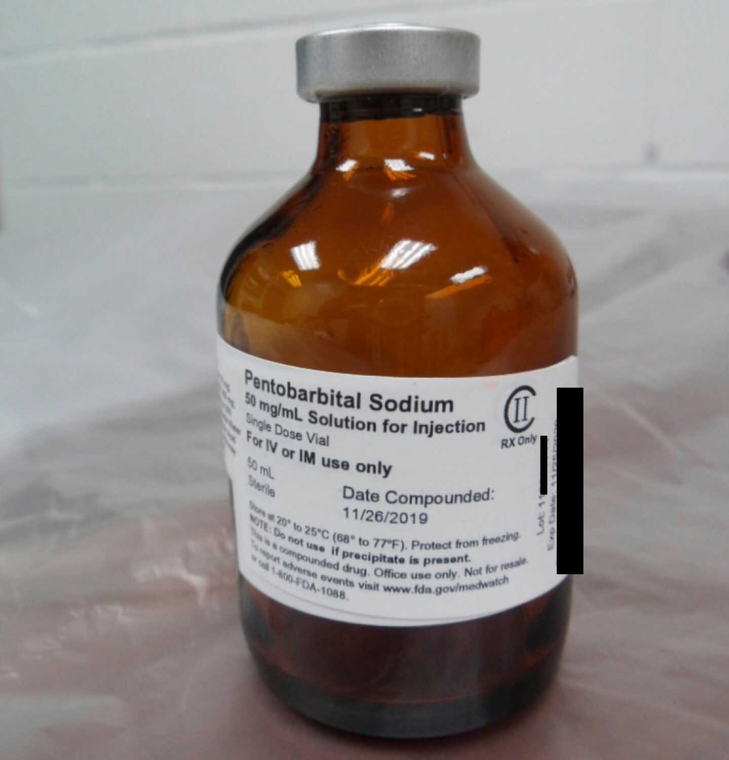 FILE - This photo provided by the U.S. Department of Justice shows a vial of pentobarbital used in ...