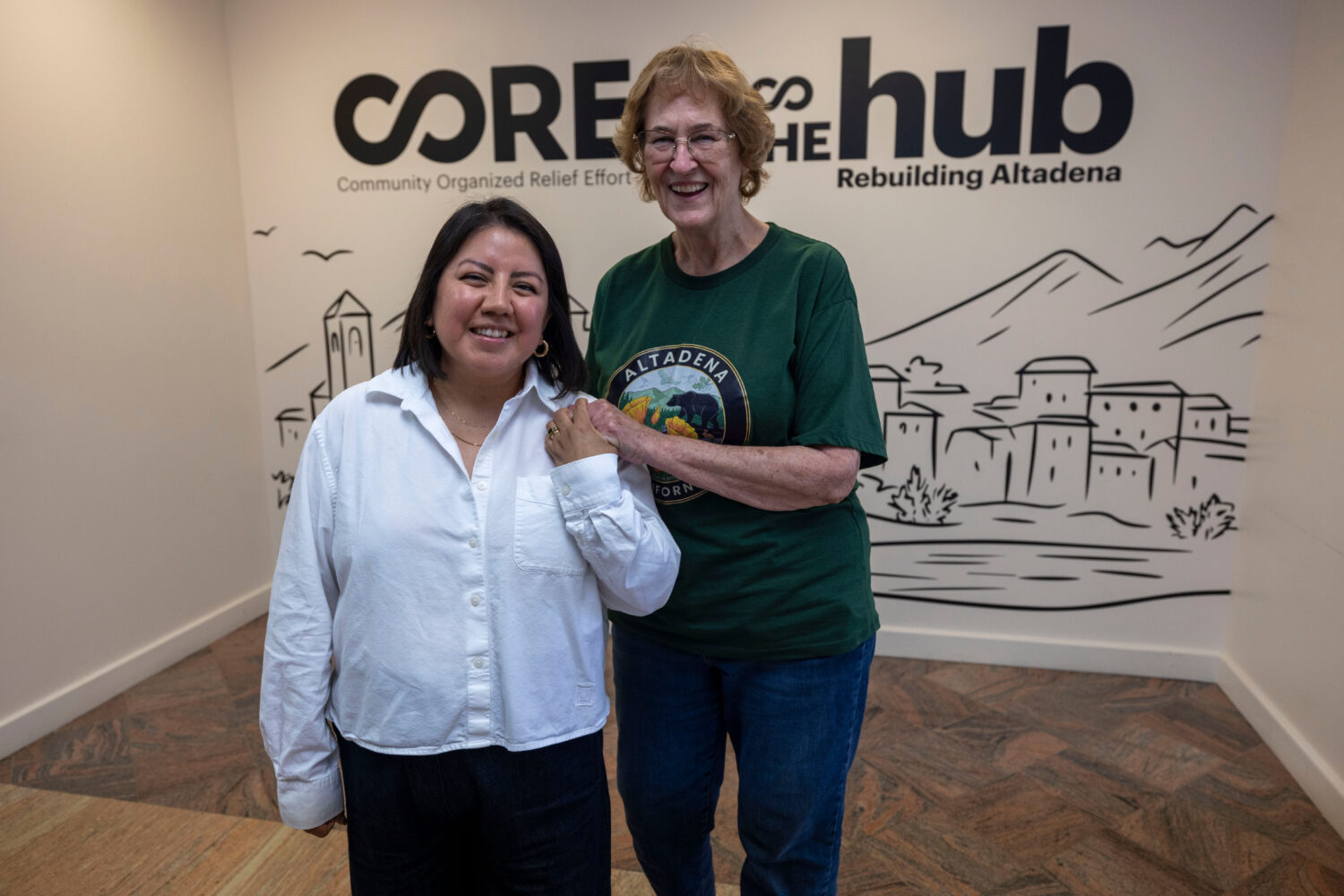 Veda Ashby Romero, left, a disaster case manager for CORE, poses for a portrait with Mary Landau, a...