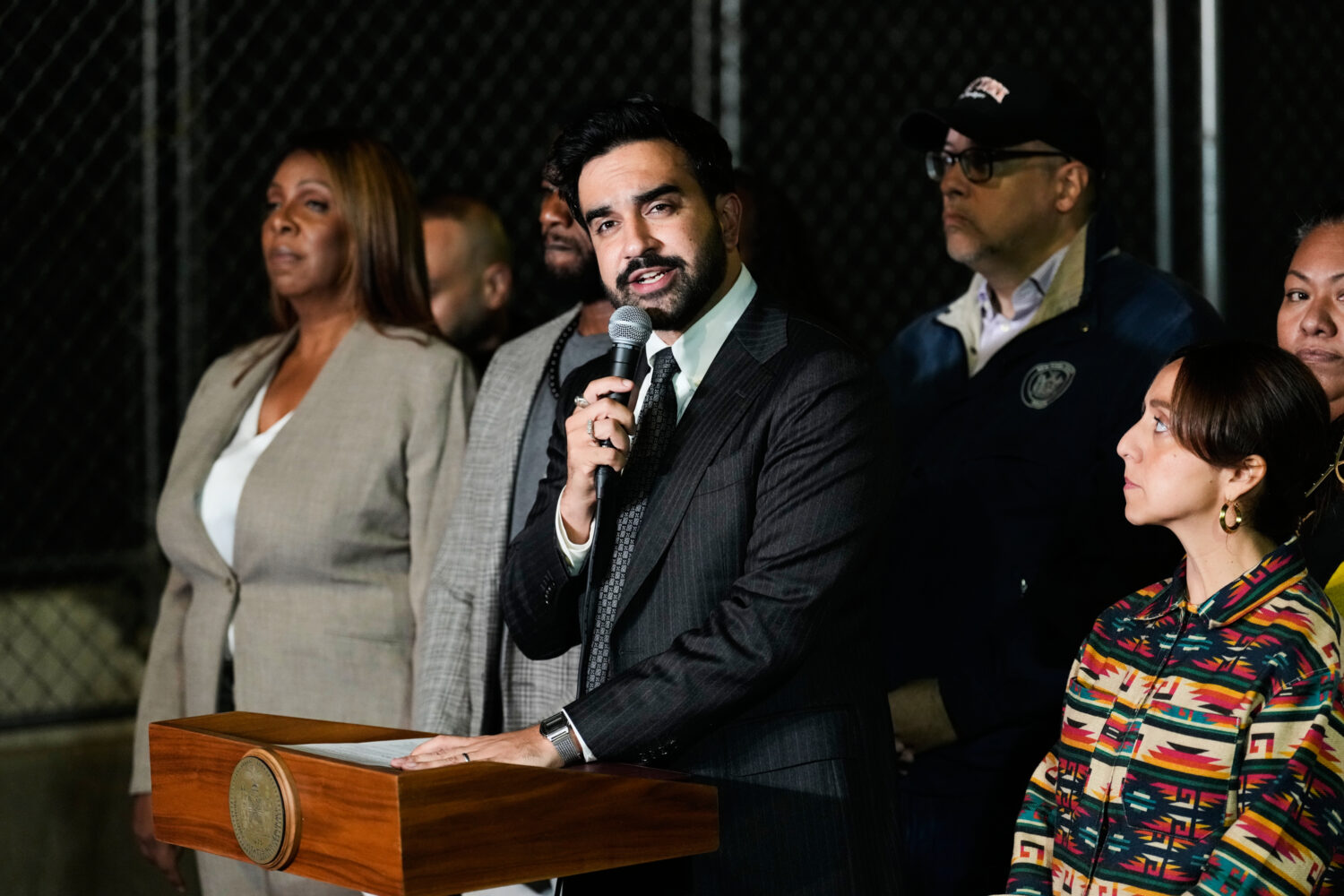 New York City Mayor Zohran Mamdani talks during a news conference near the scene of a shooting on T...