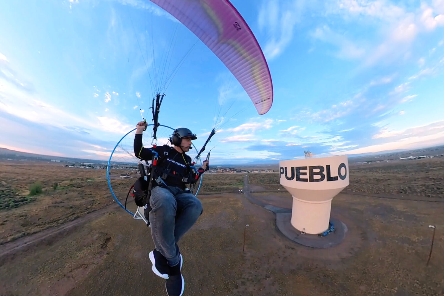 In this image taken from video provided by Jacob Hutzler shows Hutzler flies his paramotor to work ...