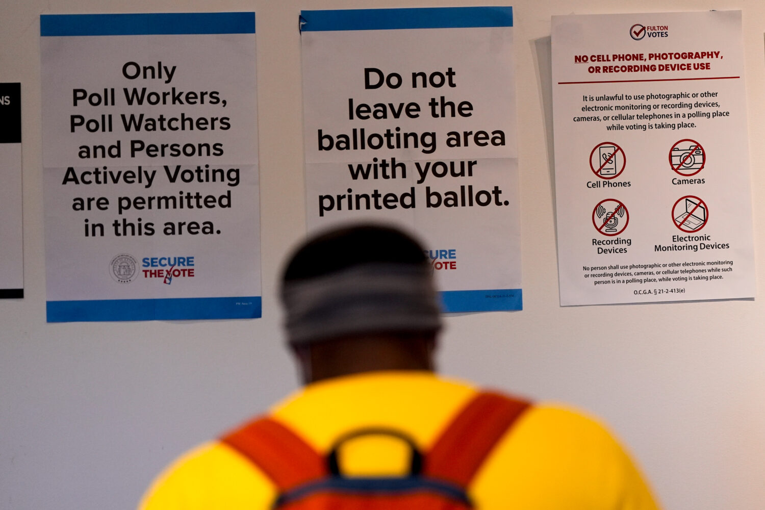 A man walks inside the The High Museum of Art voting center on the first day for early voting in Ge...