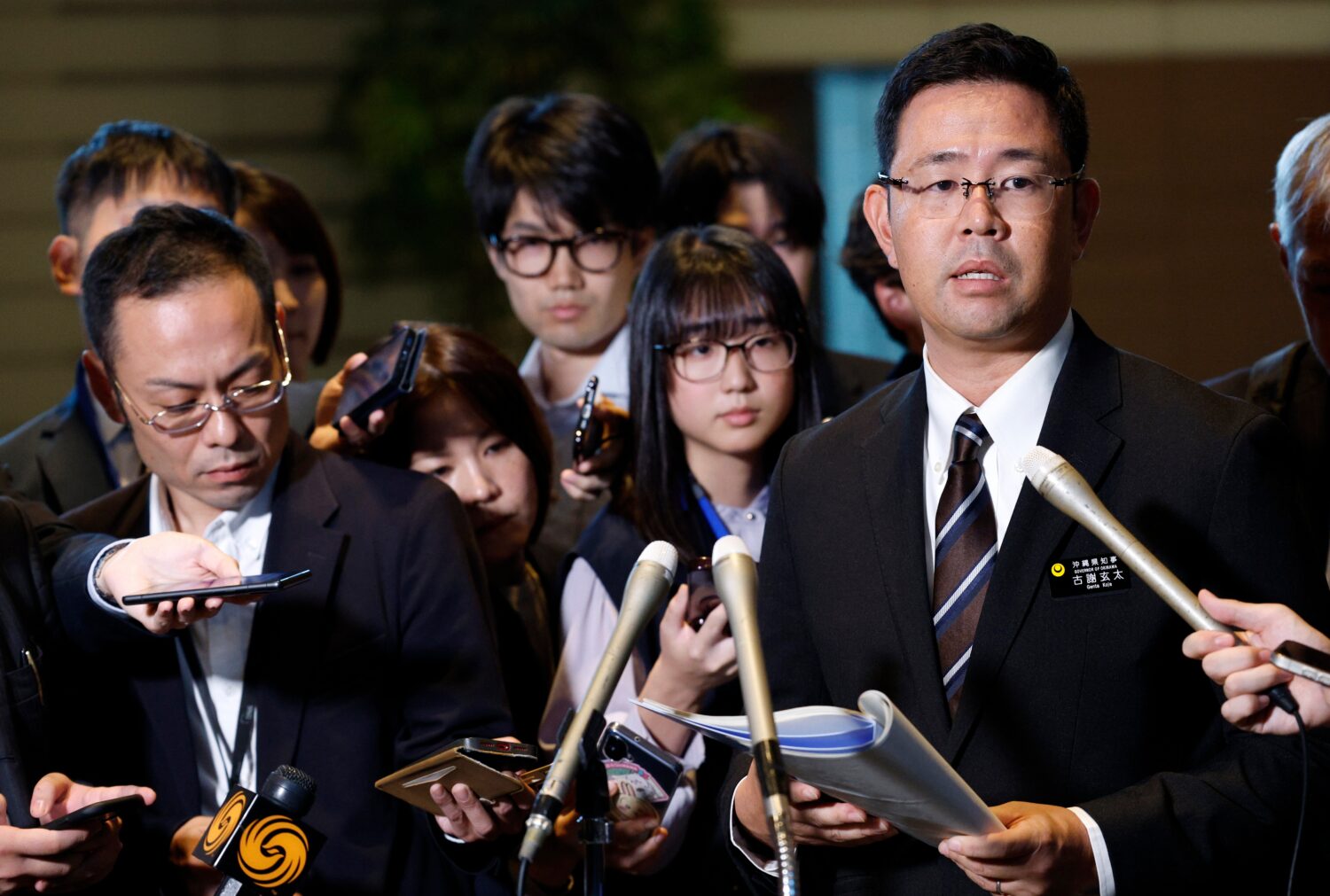 Okinawa Governor Genta Koja speaks to reporters after his meeting with Japanese Prime Minister Sana...