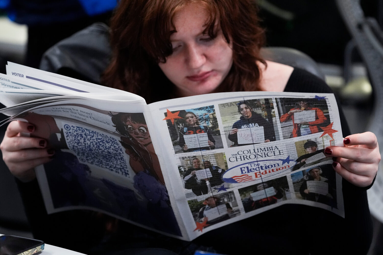 FILE - Columbia College Chicago student Kailey Ryan reads a newspaper in Chicago on Nov. 5, 2024. (...