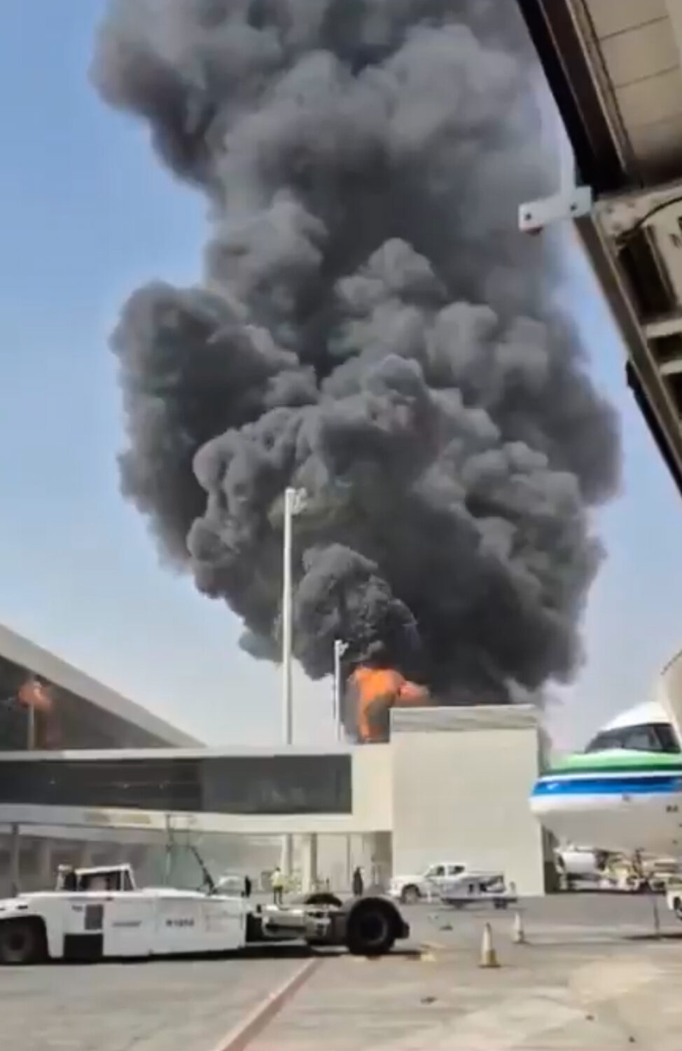 This image from video obtained and verified by AP shows thick black smoke and flames rising from a ...