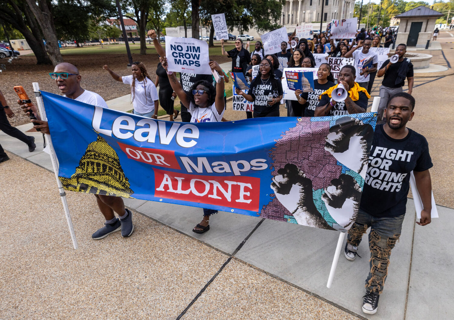 Protesters march to the Capitol after the ACLU of Mississippi's voting rights rally on the Supreme ...